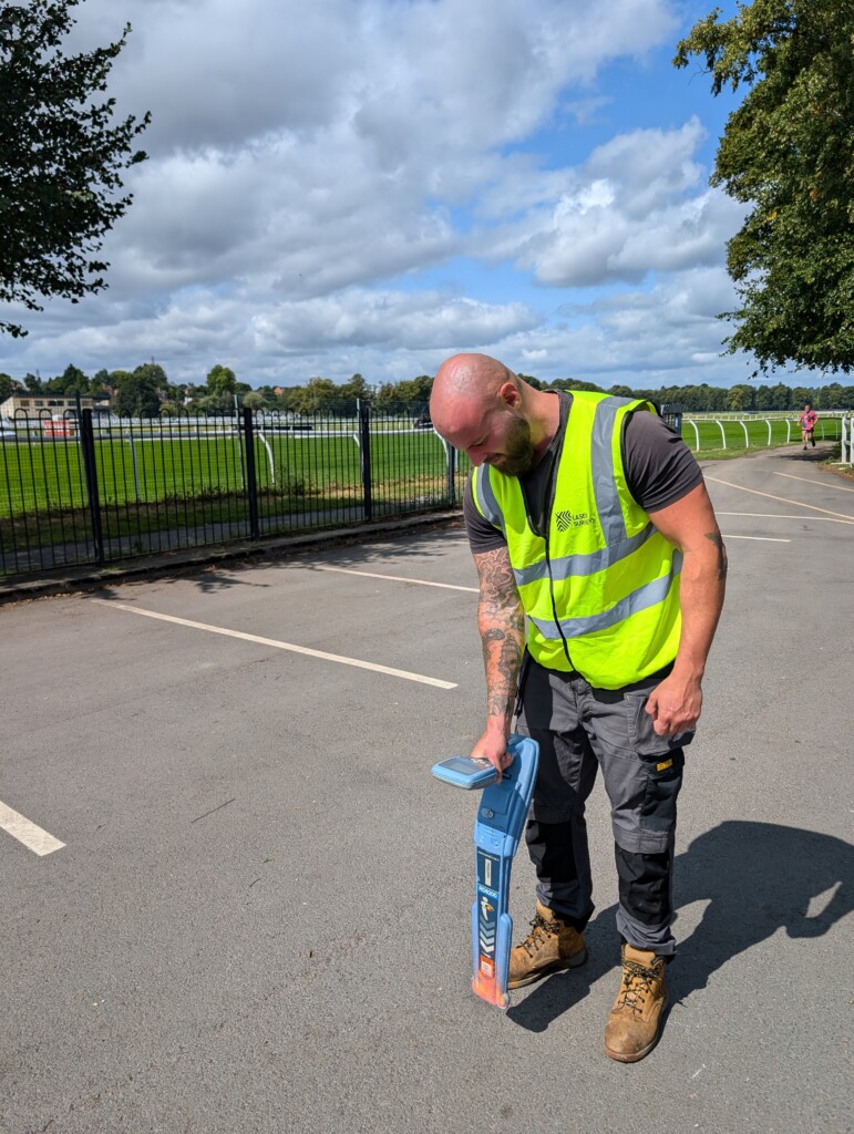 Utility detection survey using cat and genny to locate buried services in a Worcestershire car park