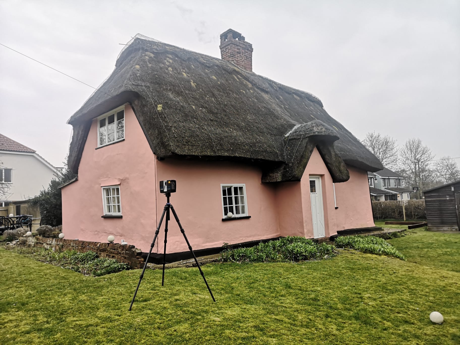 Undertaking a measured building survey of a pink house